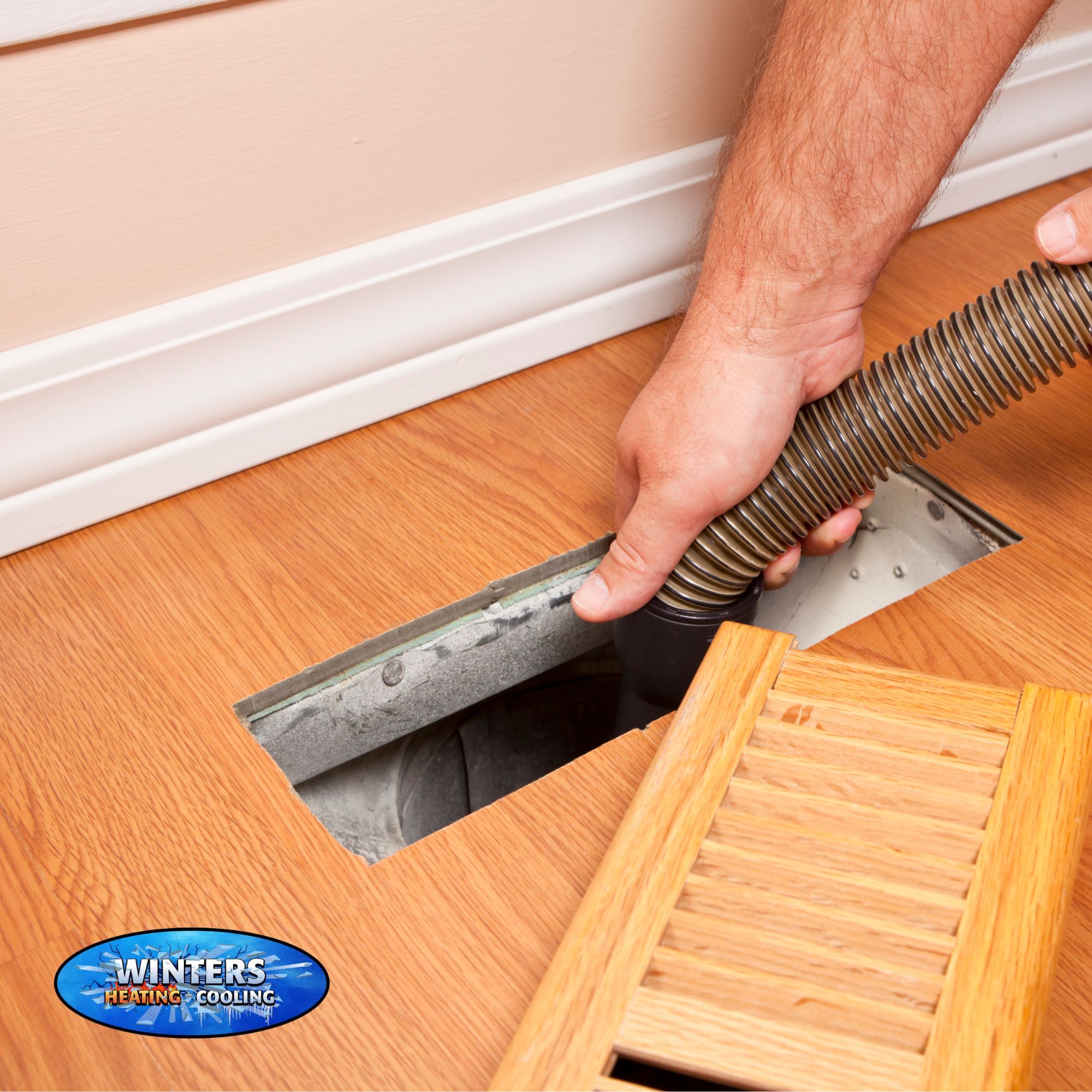 person cleaning out a home air duct