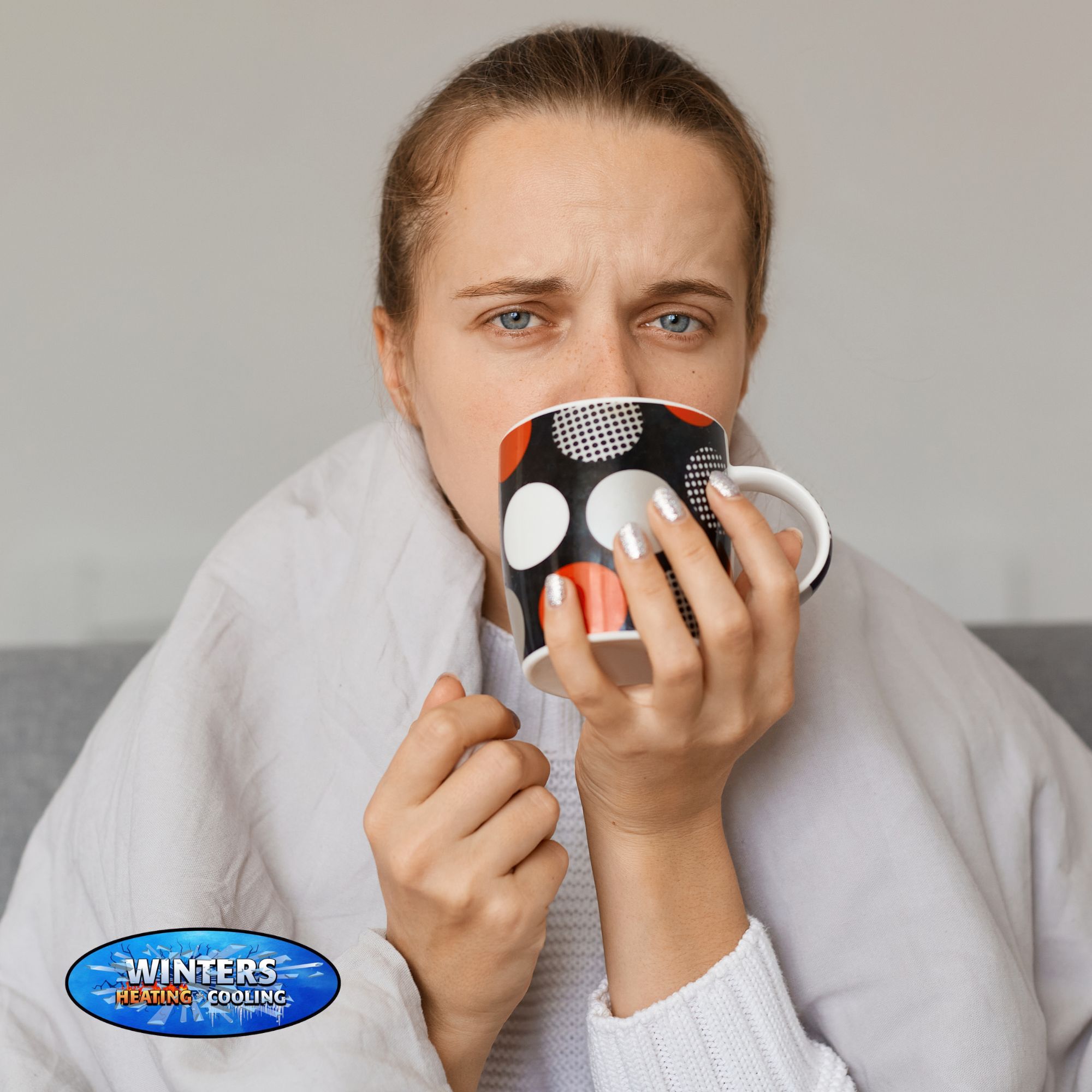 woman drinking tea with a blanket