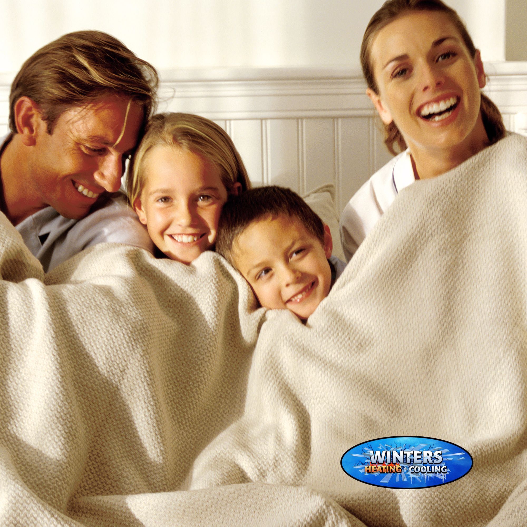 family keeping warm under blankets