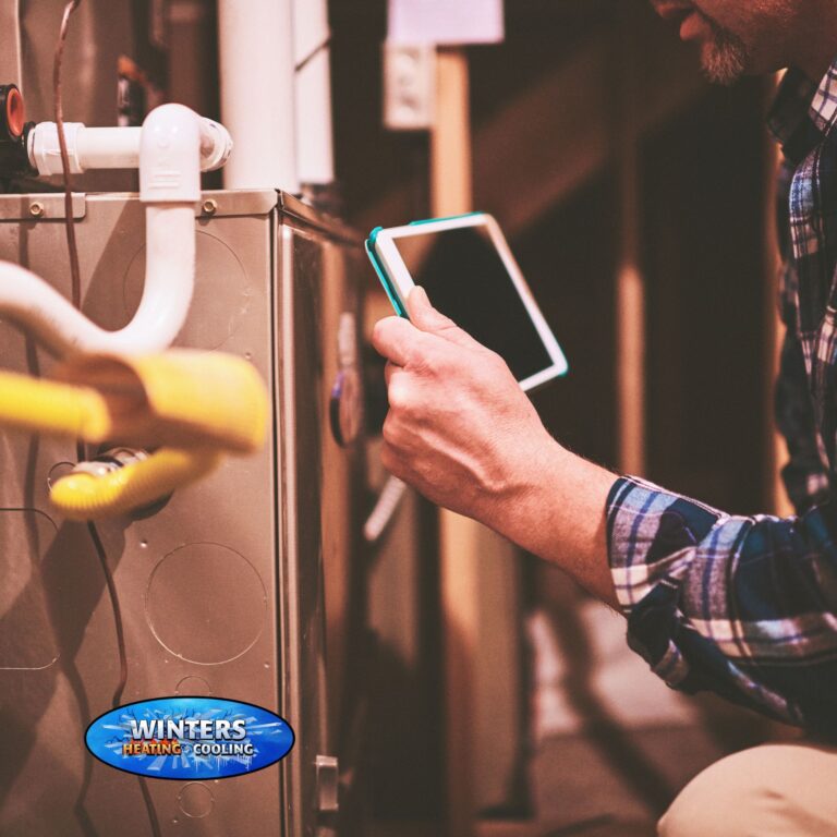 HVAC technician checking furnace